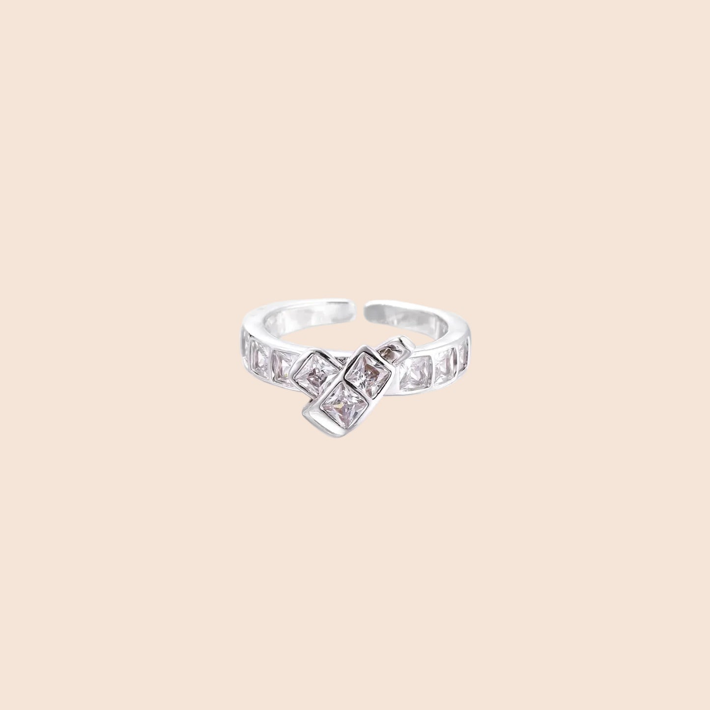 White gold plated adjustable ring featuring offset square cubic zirconia stones in an architectural stacked design