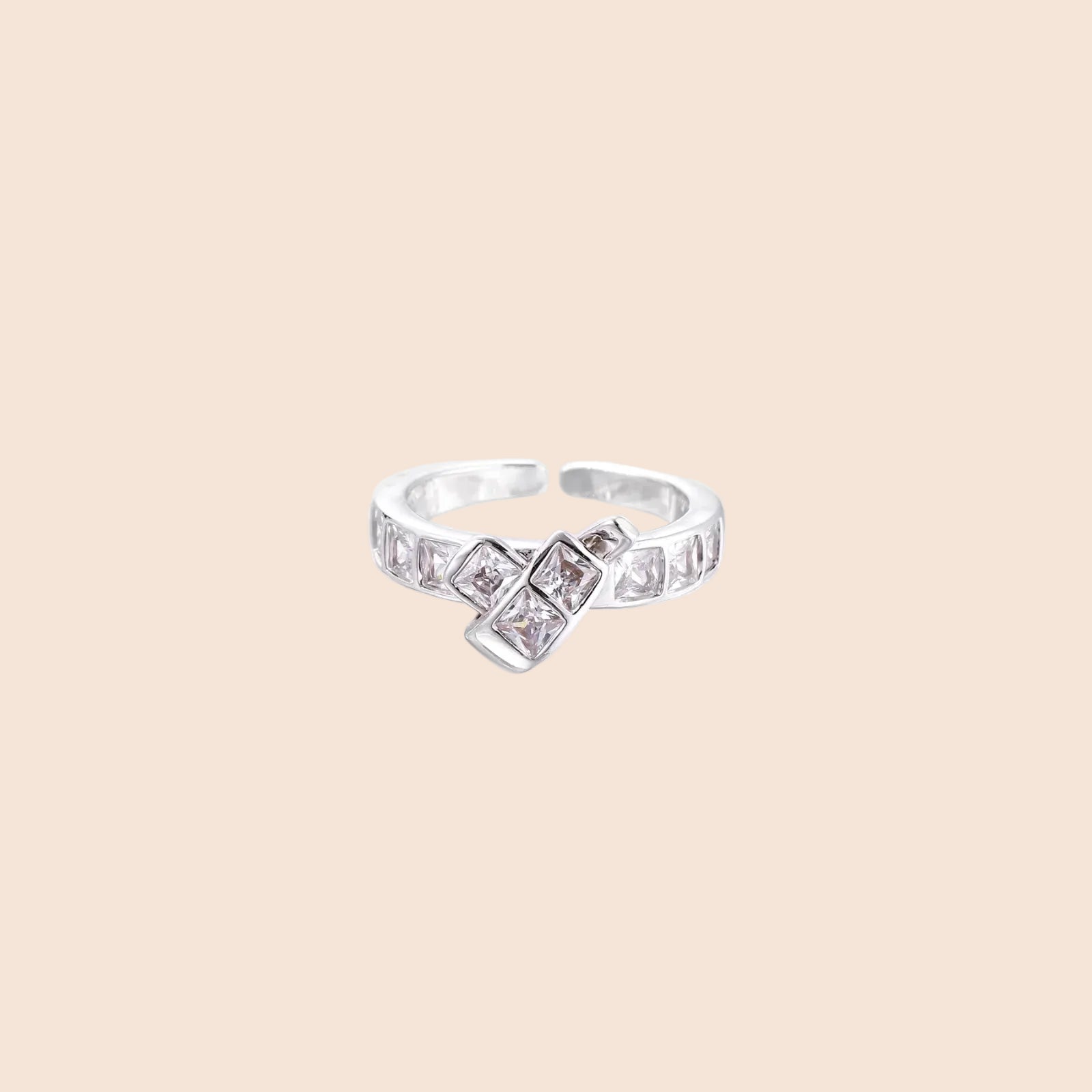White gold plated adjustable ring featuring offset square cubic zirconia stones in an architectural stacked design