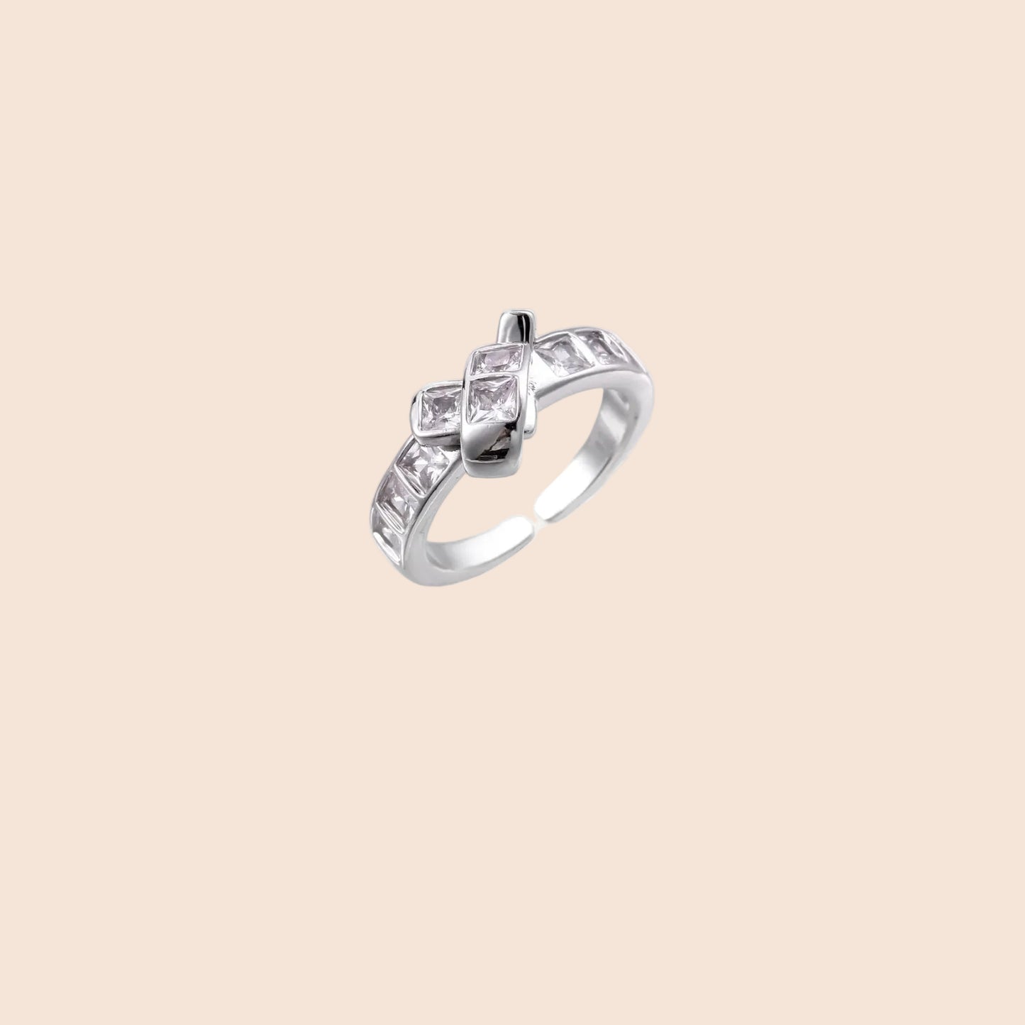 White gold plated adjustable ring featuring offset square cubic zirconia stones in an architectural stacked design