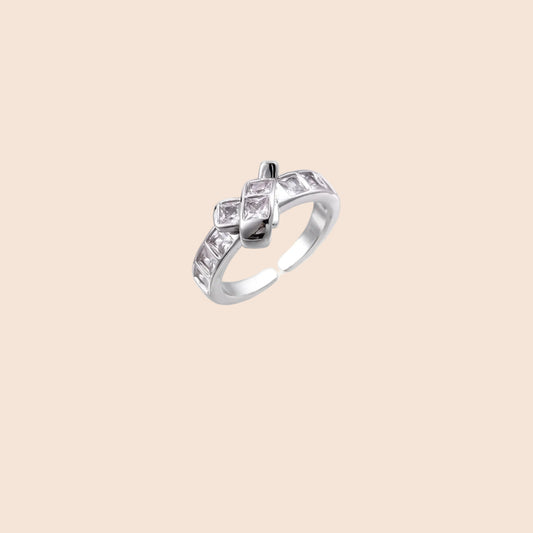 White gold plated adjustable ring featuring offset square cubic zirconia stones in an architectural stacked design