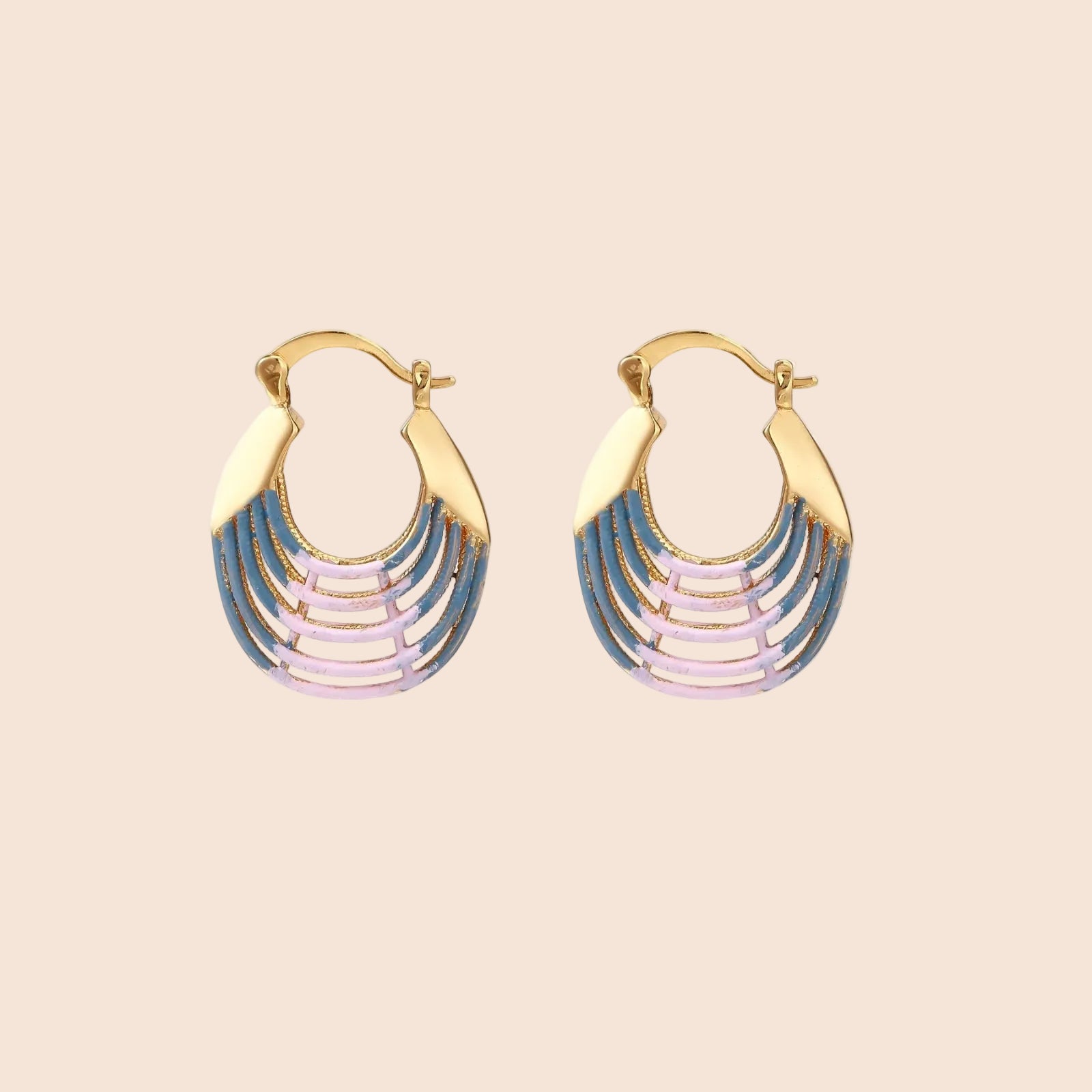 Gold hoop earrings with gradient blue-to-pink enamel in ribbed fan design on beige background