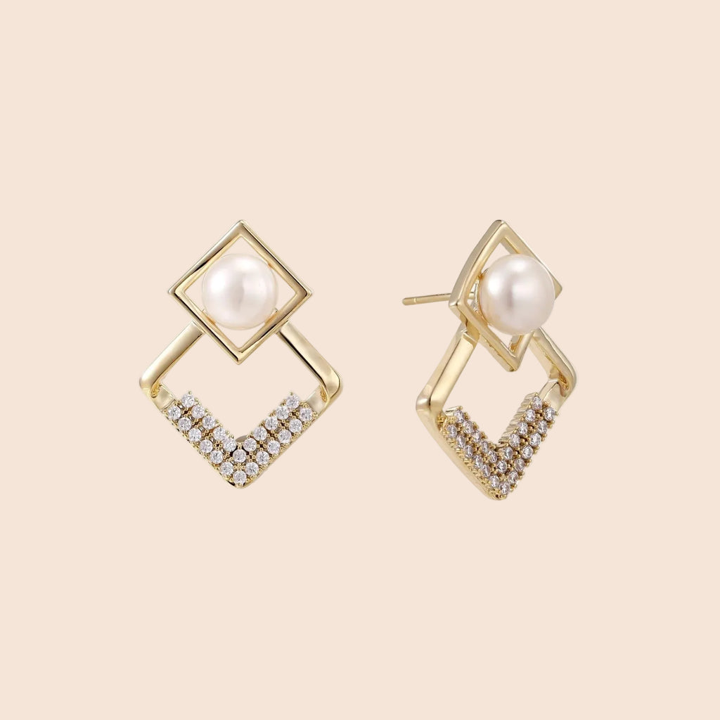 Gold-plated double square frame earrings with freshwater pearl and crystal accents on white background
