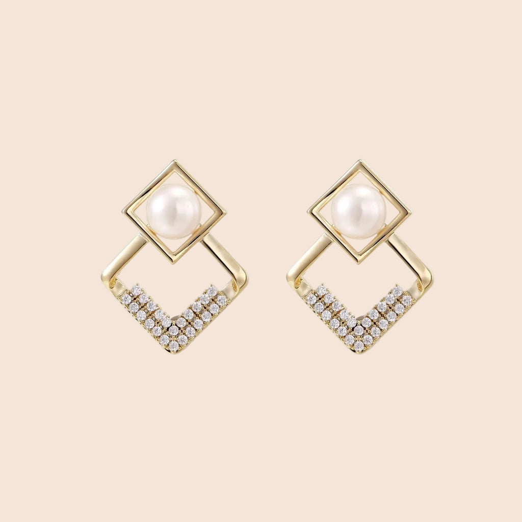 Gold-plated double square frame earrings with freshwater pearl and crystal accents on white background