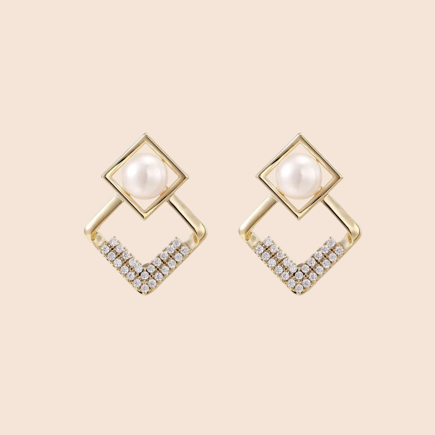 Gold-plated double square frame earrings with freshwater pearl and crystal accents on white background