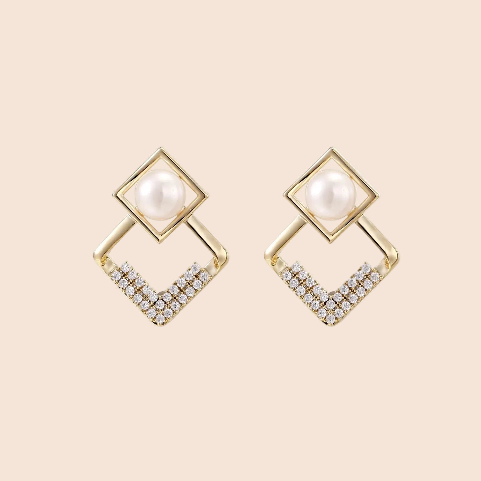 Gold-plated double square frame earrings with freshwater pearl and crystal accents on white background