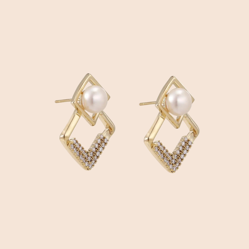 Gold-plated double square frame earrings with freshwater pearl and crystal accents on white background