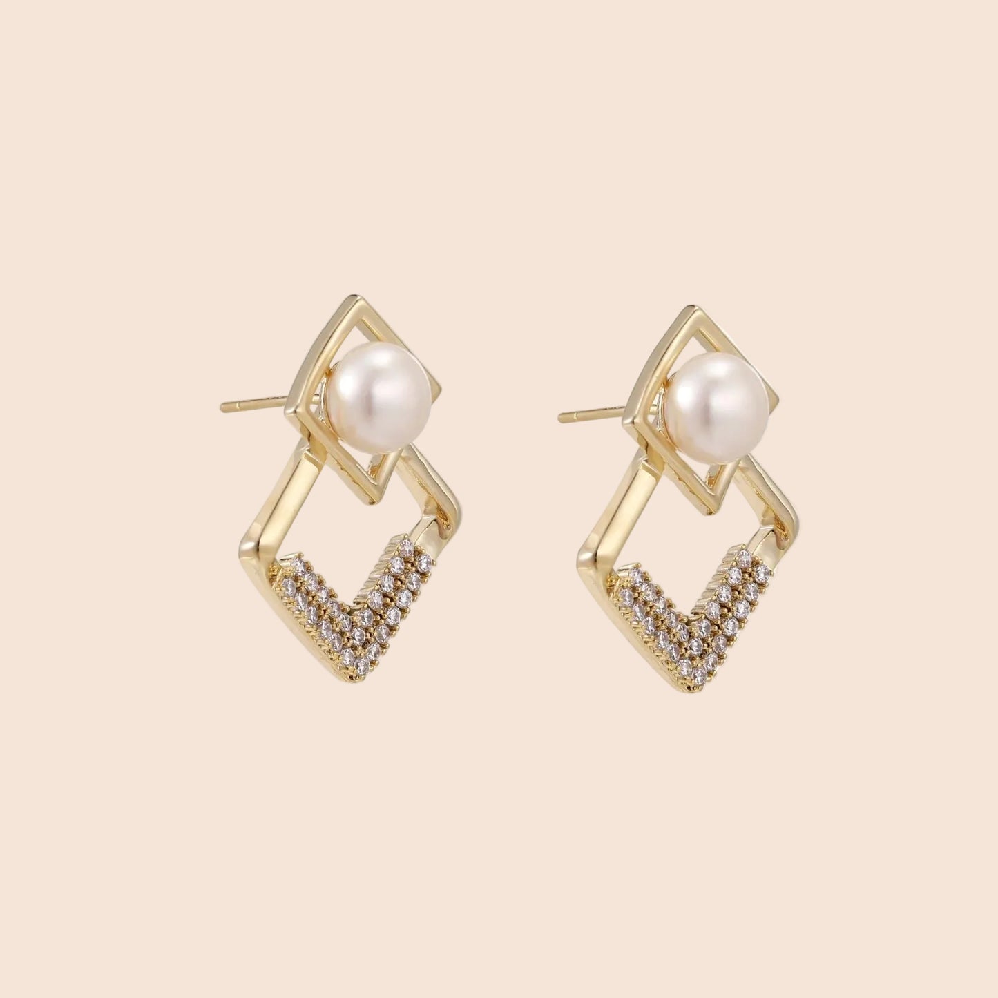 Gold-plated double square frame earrings with freshwater pearl and crystal accents on white background