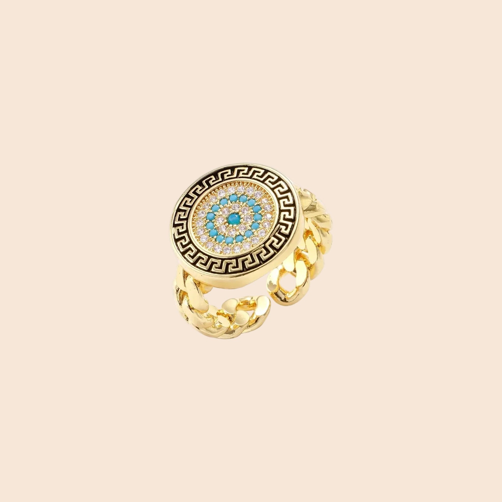 Gold chain ring with Greek key border and turquoise evil eye center on white background