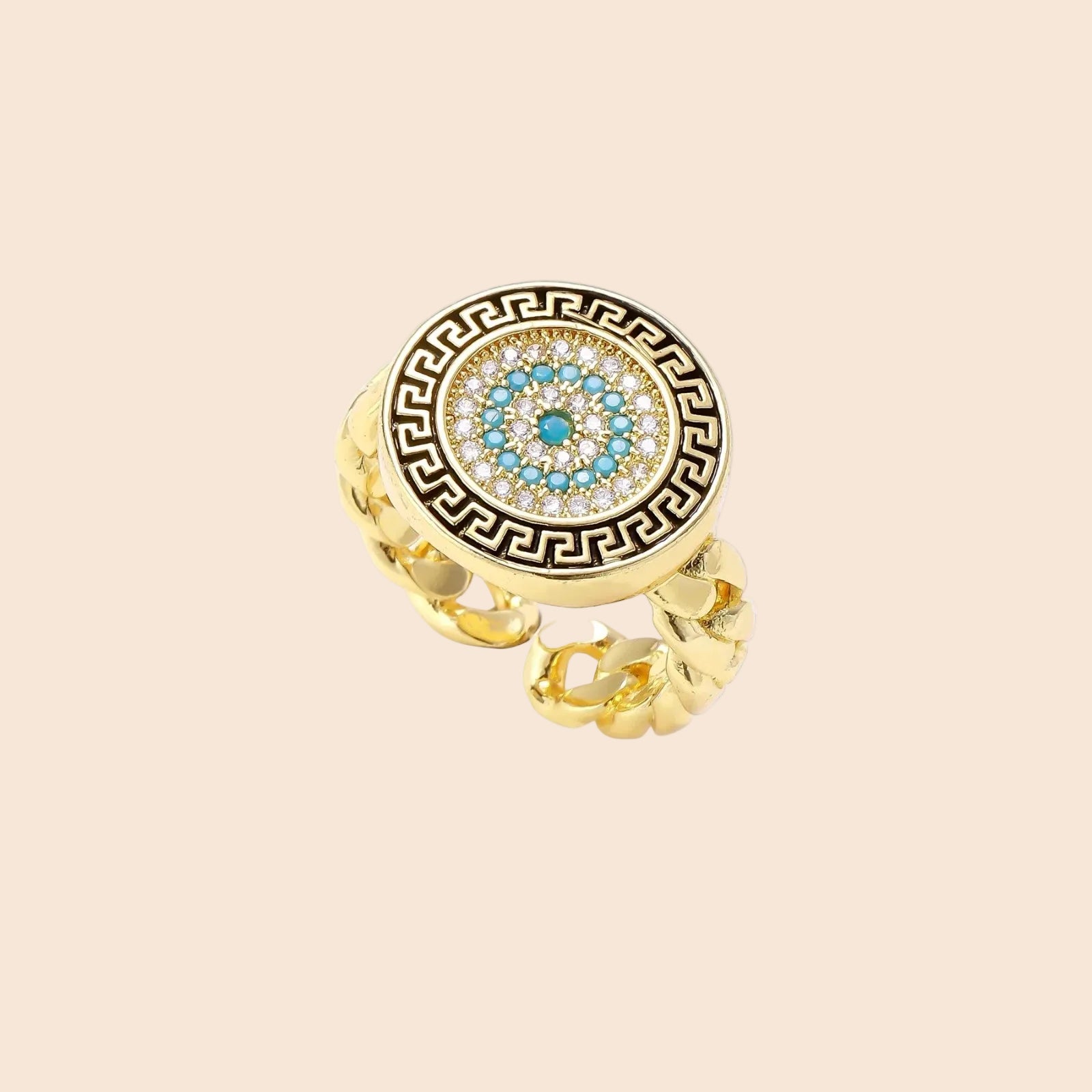 Gold chain ring with Greek key border and turquoise evil eye center on white background