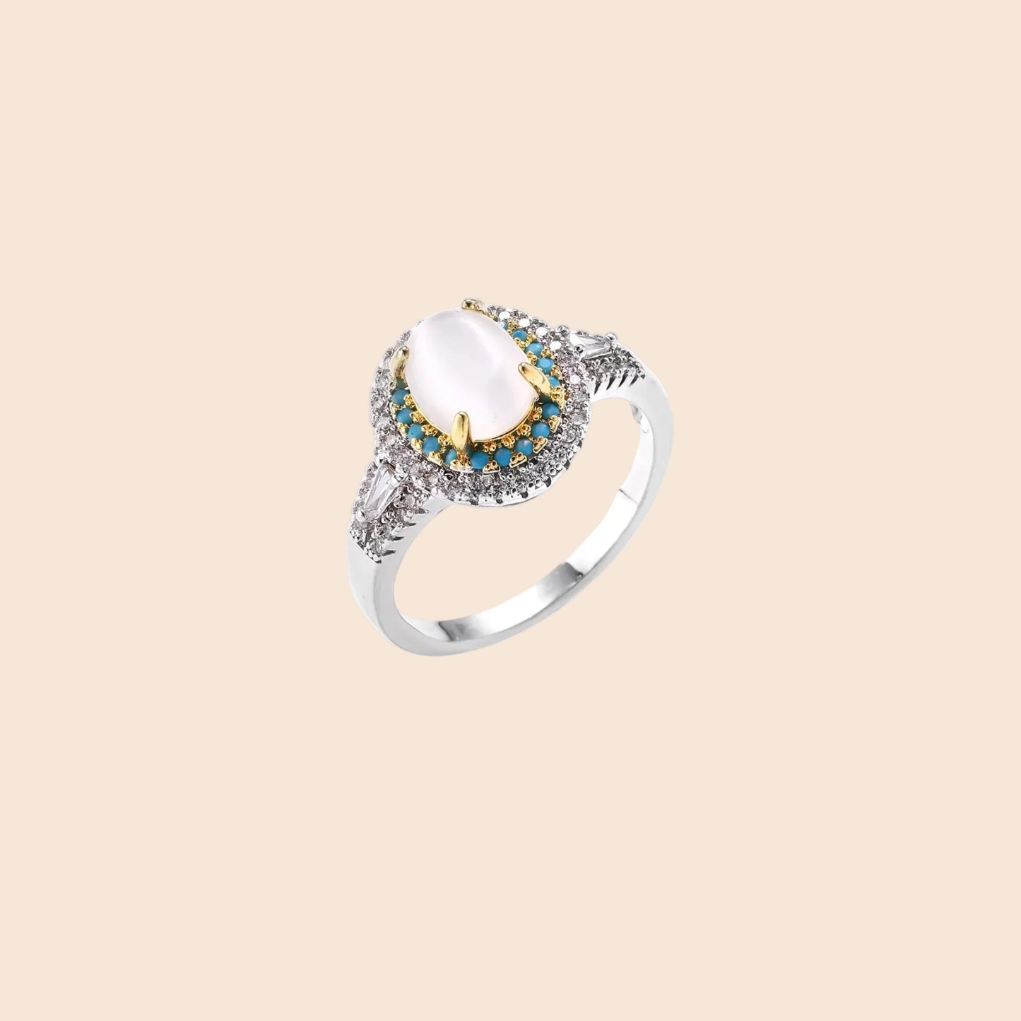 Vintage-style cocktail ring with luminous cat's eye center stone surrounded by turquoise and crystal double halo on white gold plated band