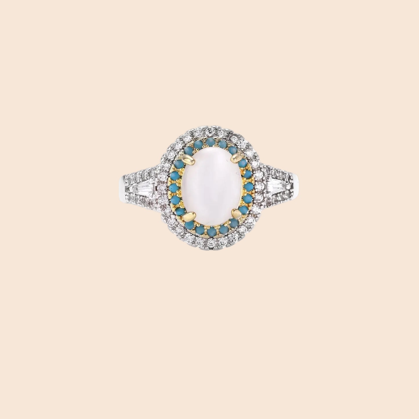 Vintage-style cocktail ring with luminous cat's eye center stone surrounded by turquoise and crystal double halo on white gold plated band