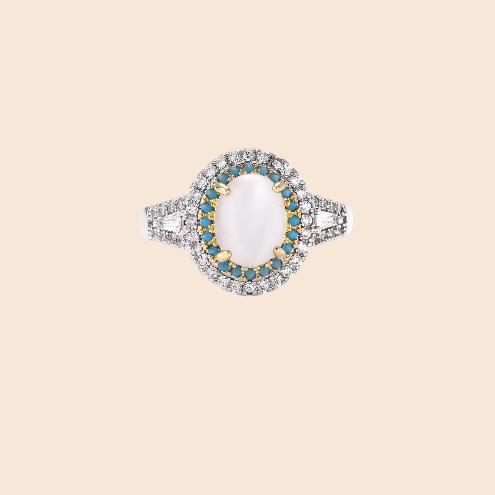 Vintage-style cocktail ring with luminous cat's eye center stone surrounded by turquoise and crystal double halo on white gold plated band