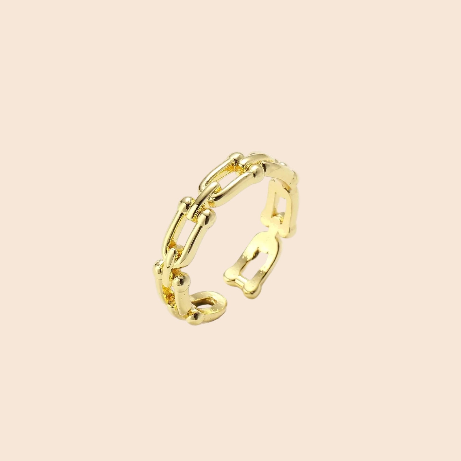 Two adjustable gold rings: chain-link band and halo-style ring with cubic zirconia stones on cream background