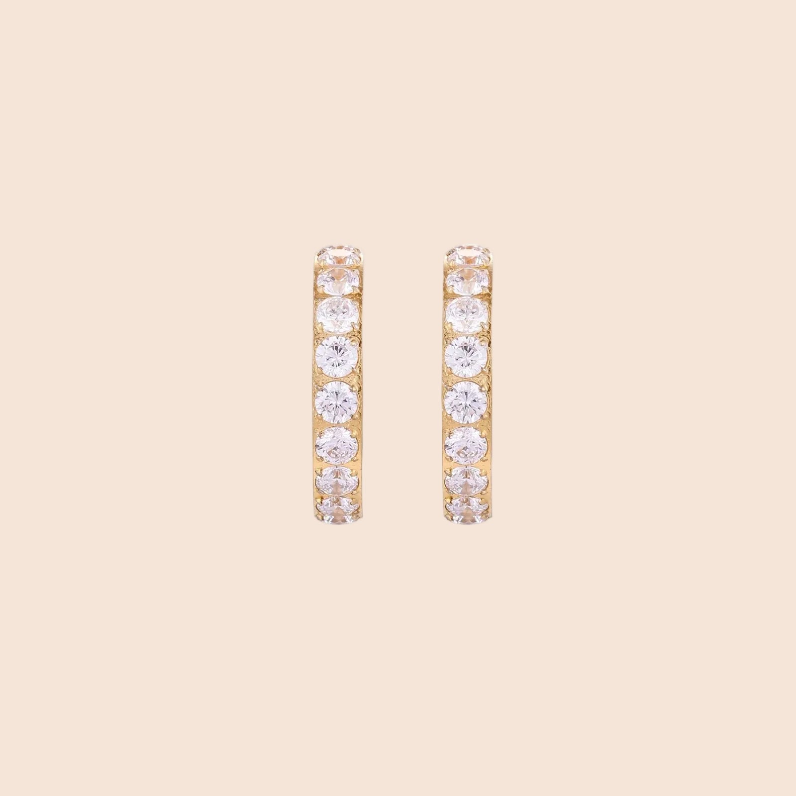 Gold pavé hoop earrings with two freshwater pearls nestled inside the curved design, featuring crystal-studded outer edge.
