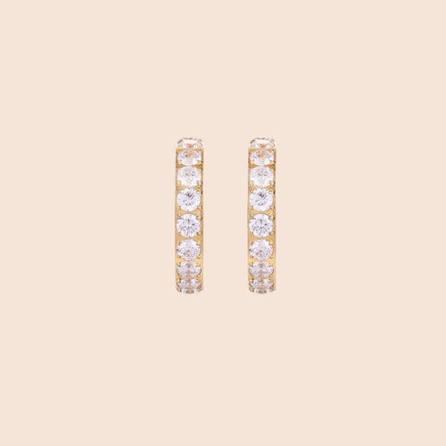 Gold pavé hoop earrings with two freshwater pearls nestled inside the curved design, featuring crystal-studded outer edge.