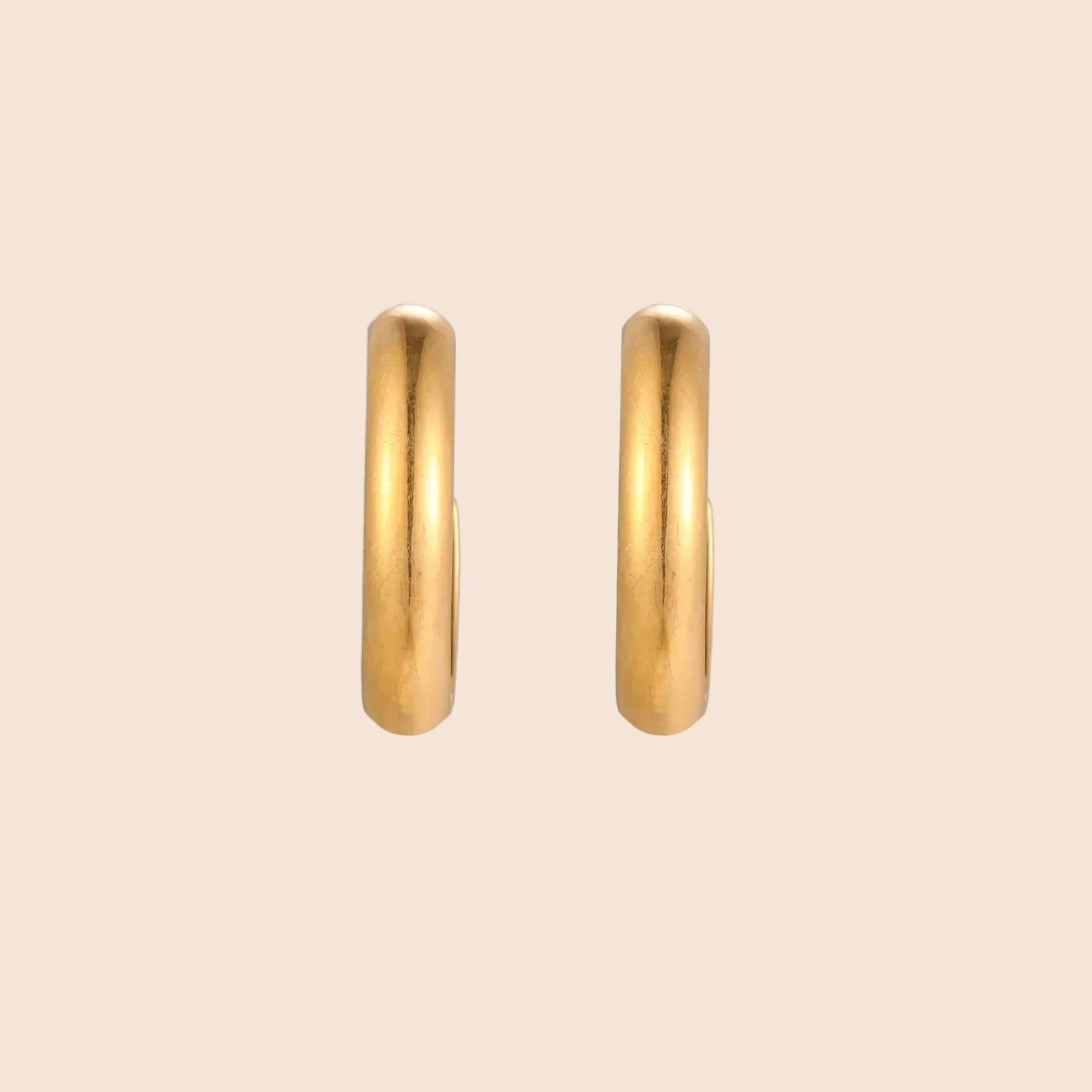 Chunky brushed gold hoop earrings in 14K plated stainless steel on cream background, front and side view.