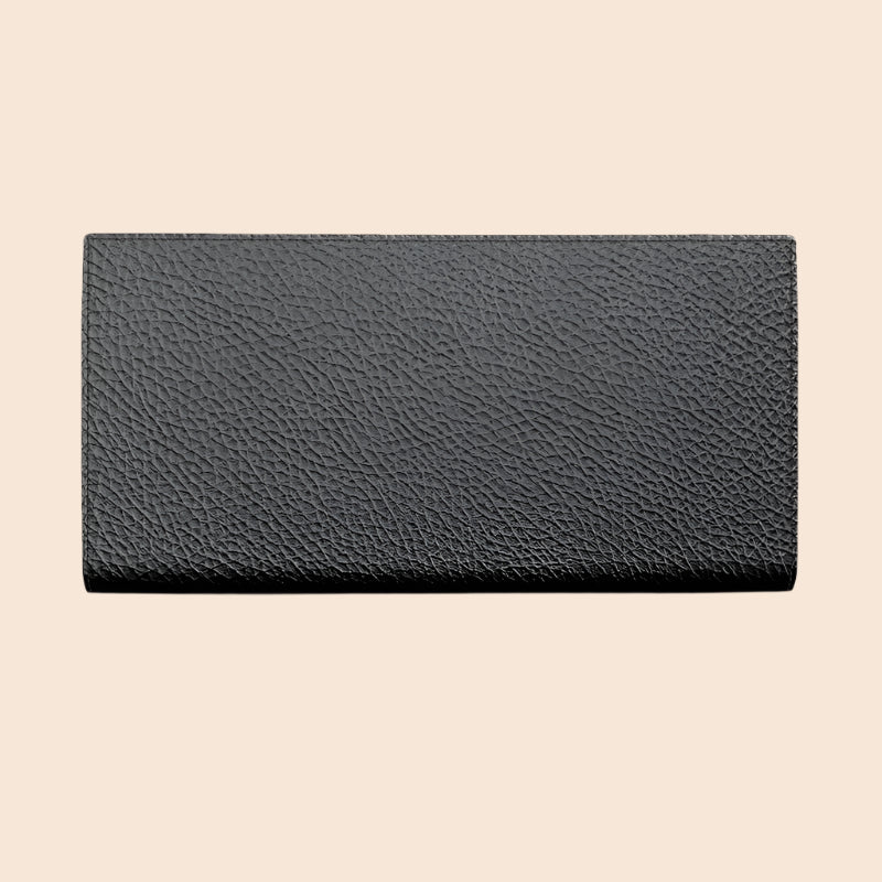 Luxia luxury travel wallet in black leather with textured surface and compact design for organized travel